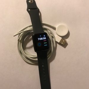 Apple 7000 Series 38MM with dark gray band.